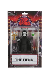 Action figure of The Fiend in blister card packaging with bonus cutout backdrop