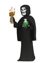 Grim Reaper fiend figure holding a candelabra and potion in blister card packaging