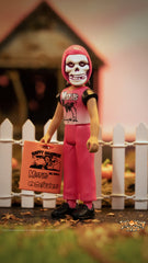 Skeleton-faced Halloween Kids ReAction Figure in pink holding a trick-or-treat bag